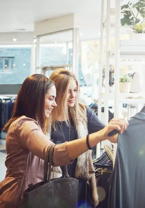 International shoppers making a retail purchase and paying in their home currency with Dynamic Currency Conversion (DCC)